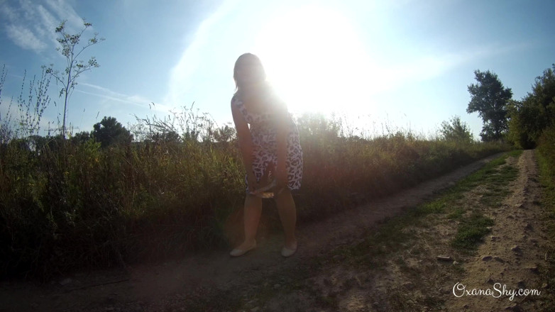 MILF Oxana: Flashing and naughty fun at the riverside