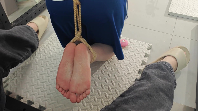 Asian bondage: A Girl with a Metal Gag in Place, Playing with...