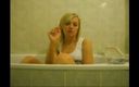 Femdom Austria: Blonde bitch in the bathtub smoking cigarettes