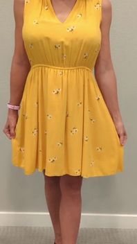 Stella in a Yellow Sun Dress with Black Heels