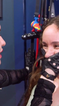 Mistress Elysia Slams Slave Mila Against Wall to Put Hand Over Her Face, Ending in Steamy Lesbian BDSM Kiss