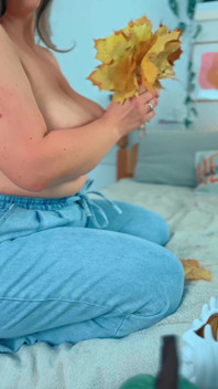 A Big Smile From a Beautiful MILF with Leaves