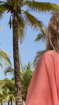 A Busty Blonde Woman Is Walking Around and Showing Her Naked Body on the Beach.