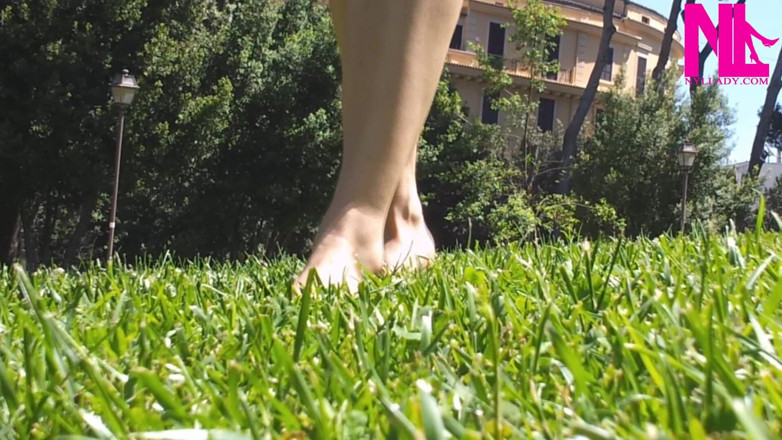 Nyllady: Nyllady Walking Barefoot on Th Grass in a Park