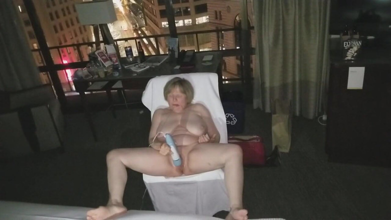 MarieRocks: See the 63-year-old hottie masturbating in a hotel room window