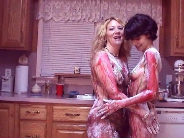 Girls get hot for each other and paint each other's nice tits on kitchen floor--Girl on Girl