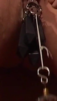 Chained Cougar Gets Her Pussy Heavily Clamped and Weighted
