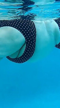 Couple Underwater Diving and Swimming