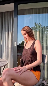 Hot Long Legs Sexy Beauty on the Balcony Flashes Her Panties Under Her Skirt Then Takes Underwear off to Show Tight Pussy