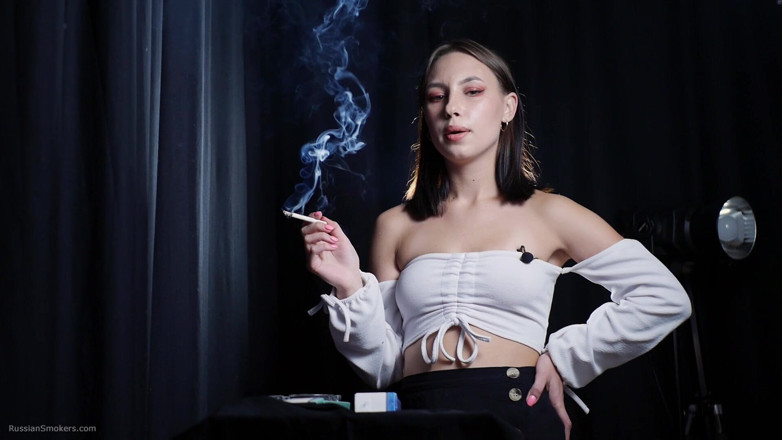 Russian Smokers: Elegant Brunette Smoking Cigarette in Dark Studio Scene