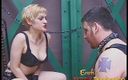 Erotic Female Domination: Blonde femdom smoking a cigarette while tormenting tattooed slave