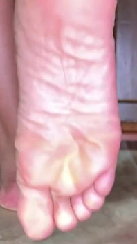 Ebony Girl Shows off Her Feet While Doing the Dishes