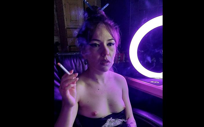 Asian wife homemade videos: A beautiful lady smokes a cigarette