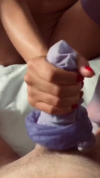 Adeline Murphy does a purple stockings footjob