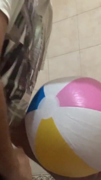 In the bathroom with a beach ball