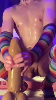 Skinny Femboy Covered in Oil and Riding a Giant Dildo!