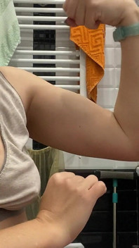 Strong Woman Shows Her Muscles and Armpits