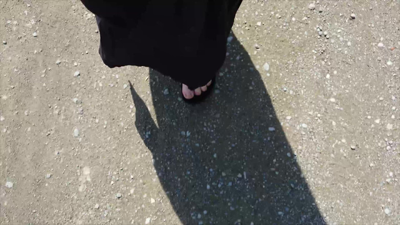 Footfetish: Outdoor in a Black Caftan and Barefoot in Black Birkenstocks