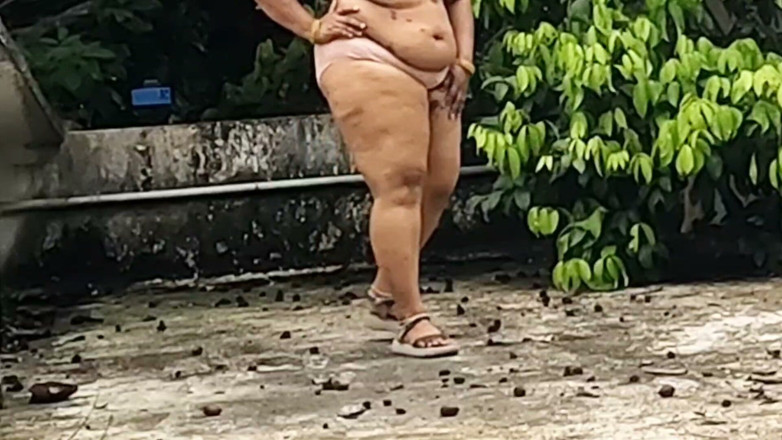 Anne Ipe: A Full-figured Woman in a White Skirt and Pink Top...