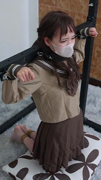 Metal Binds Her Hands, Ropes Bind Her Feet, and Her White Silk Feet Tickle