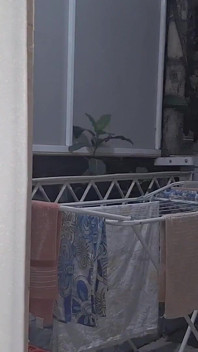 Naughty Housewife Showing off to Passers-by While Her Husband Works