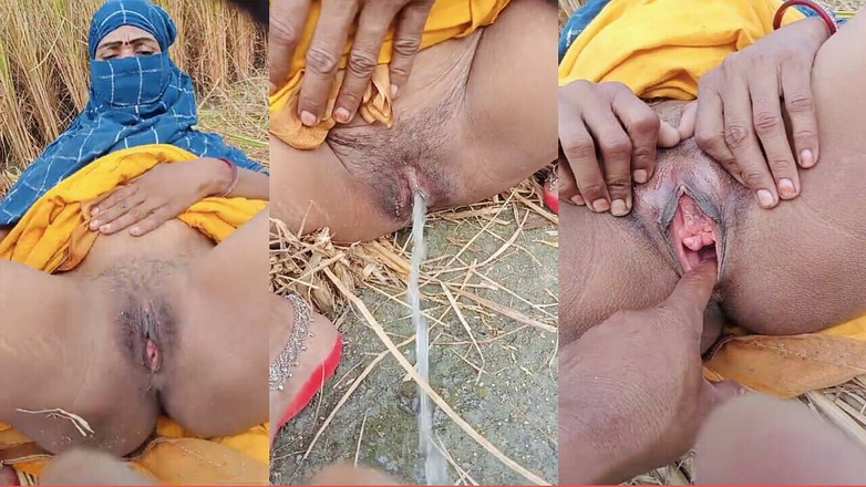 RadhaDevi: Desi Bhabhi urinerar tid videofotografering i fältet