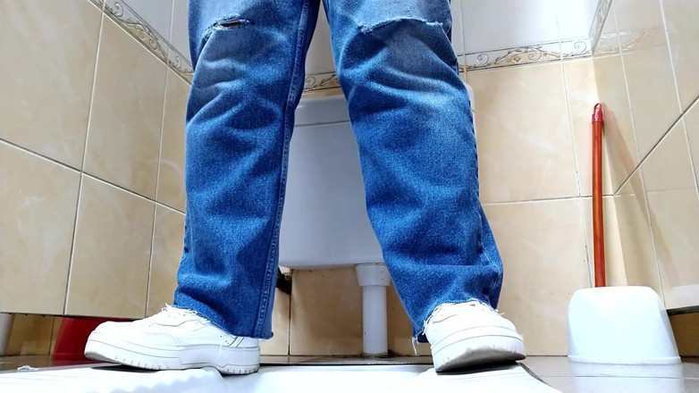 Elena: Hot MILF in jeans pissing in a public restroom