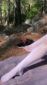 White oil shiny pantyhose in mountain forest
