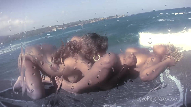 Porsha Carrera XXX: Ebony girls lick pussy on beach