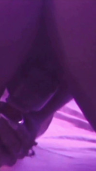 Young Girl Using Her Feet to Play with the Dildo While Masturbating