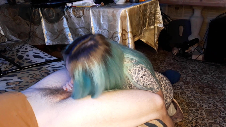 Blowjobs Alice: Asian woman with blue hair touches an uncut dick with...