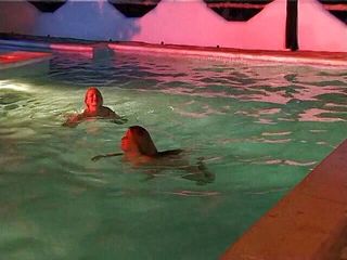 Naughty Girls: Two sexy lesbian chicks are swimming together in the swimming...