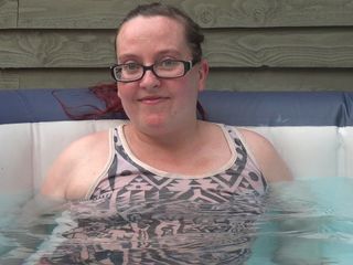 Horny vixen: Clothed in the hot tub