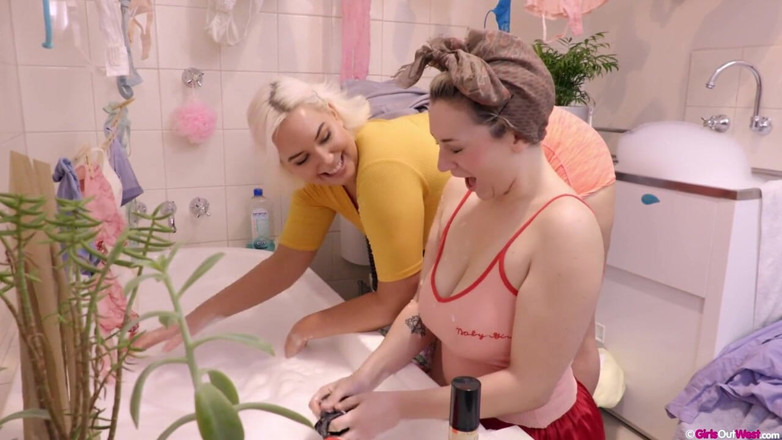 Girls Out West: Curvy busty lesbian hotties fuck in the bathroom