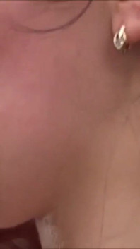 Horny brunette loves a warm load on her tits in close up