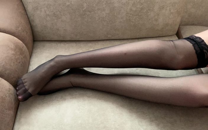 Gloria Gimson: Girl in Black Stockings Caresses Her Long Legs