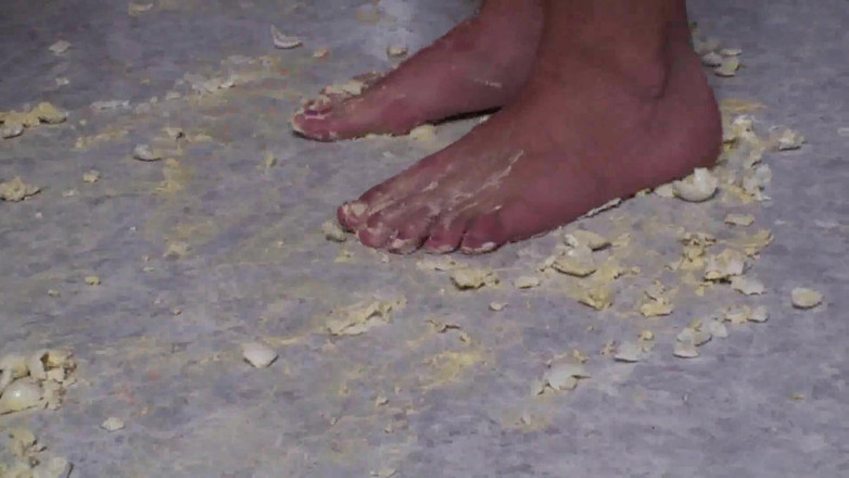Foot Girls: Brunette crushing food in the kitchen