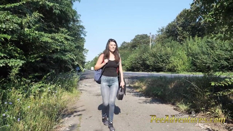 Pee Adventures: Skinny brunette hitchhiking with her bladder full