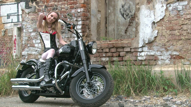 Public Entertainment: Skinny blonde on a bike