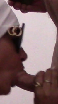 Close-up of a MILF Sucking a Cock and Taking a Load in Her Mouth.