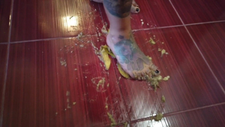 Fetish videos by Alex: A Banana Is Trampled by a Blonde Tattooed MILF