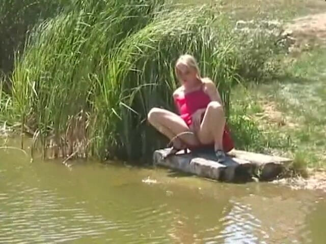 Femdom Austria: Blonde bitch spied on while pissing outdoors