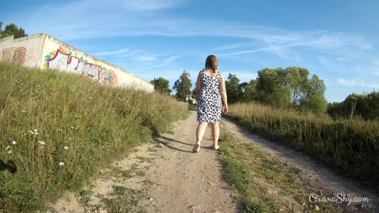 MILF Oxana: Flashing and naughty fun at the riverside