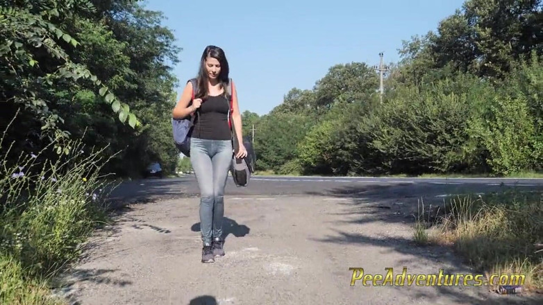 Pee Adventures: Skinny brunette hitchhiking with her bladder full