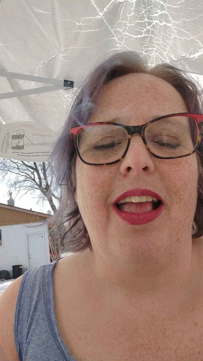 AngYourDirtyCanadian: Calm Outdoor Smoking Moment with a Playful Lipstick Look