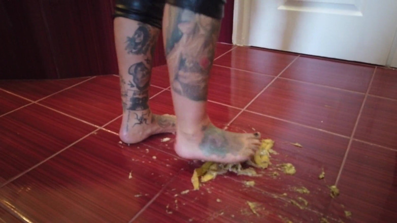 Fetish videos by Alex: A Banana Is Trampled by a Blonde Tattooed MILF