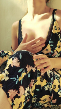 Pretty woman masturbates on camera in a dress and brings herself to a loud orgasm with her fingers.