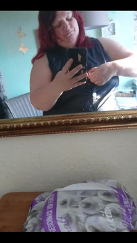 Showing off in a cool lab coat in front of the mirror