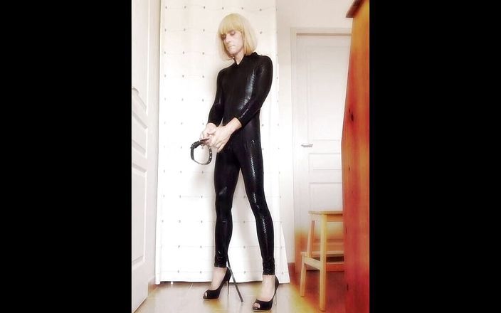 Faustine Flower: Crossdresser Faustine vinyl catsuit with necklace.