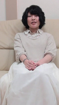 Dark Haired MILF From Asia Playing with a Loaded Pecker